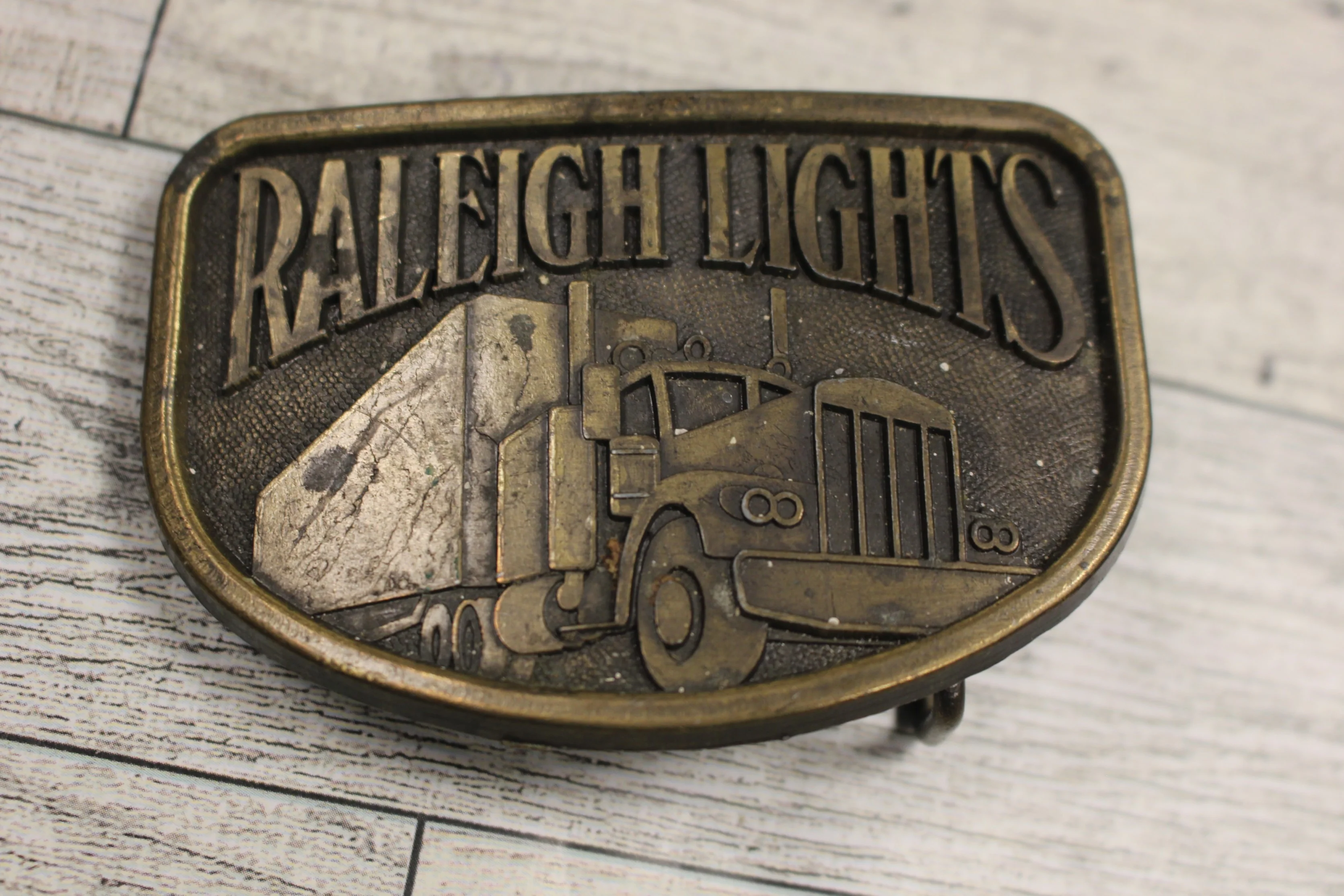"Raleigh Lights" Trucker Belt Buckle - Used